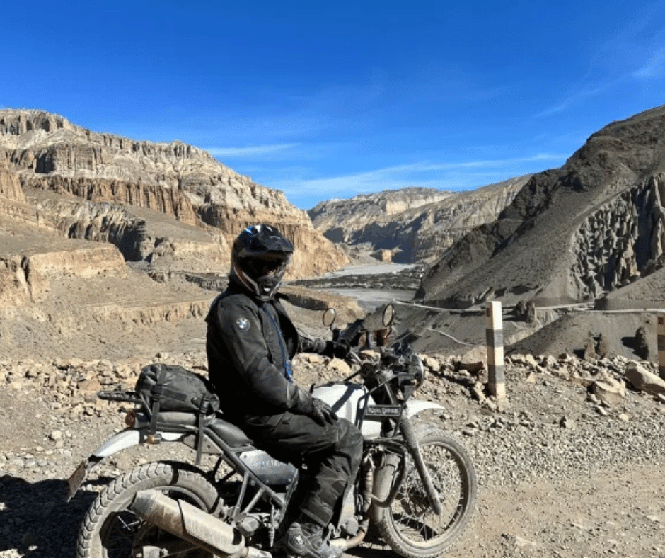 Navigating the remote landscapes of Upper Mustang, surrounded by dramatic rock formations and the raw beauty of the Himalayas.