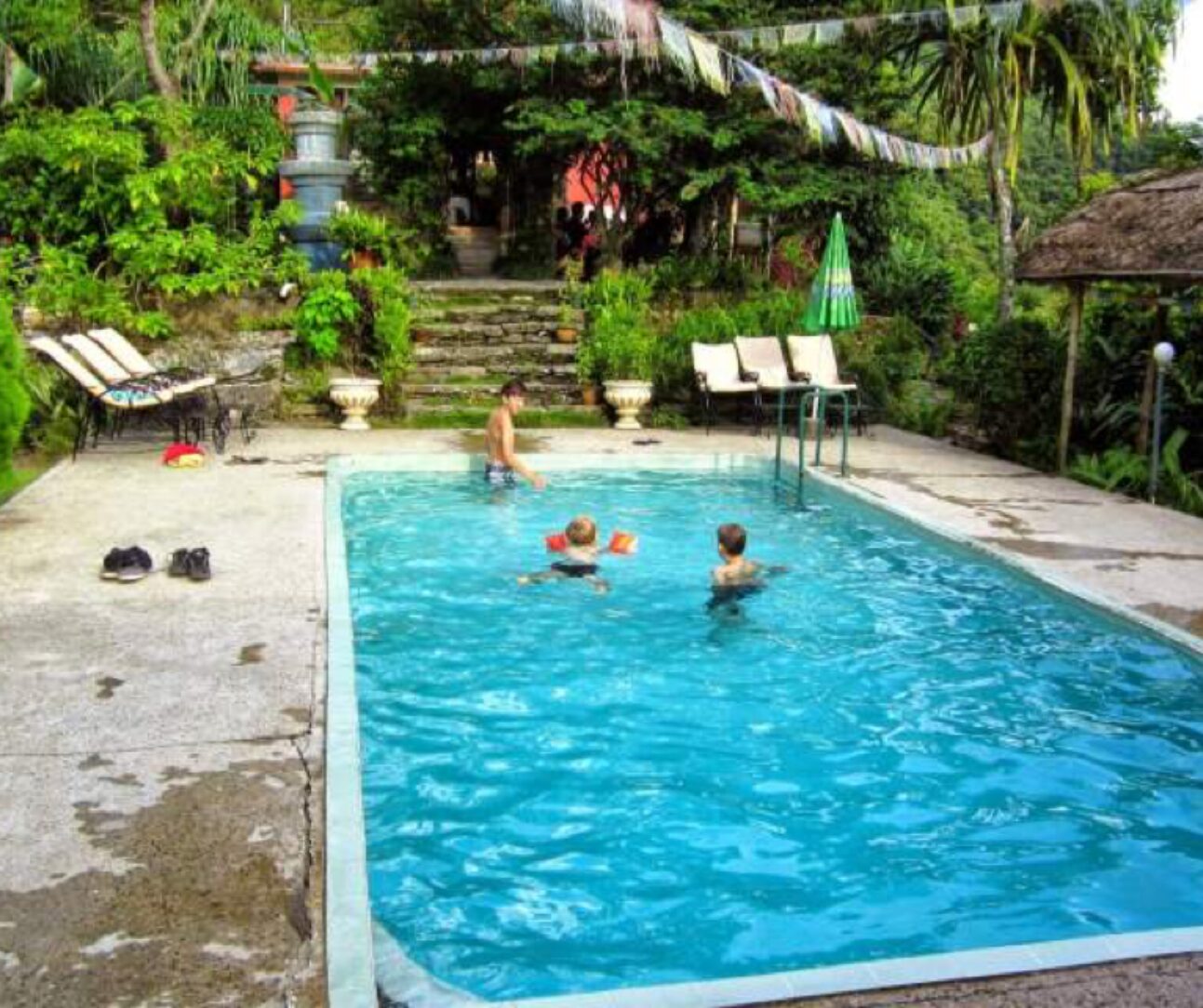 enjoying the swimming pool after a trek