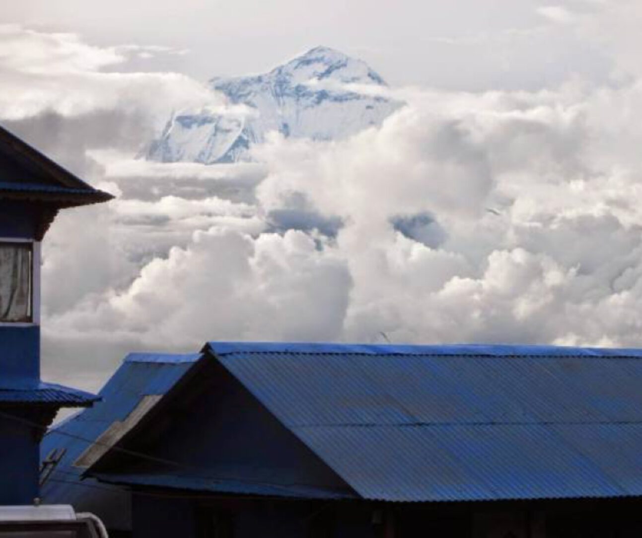 mountain peak through the clouds