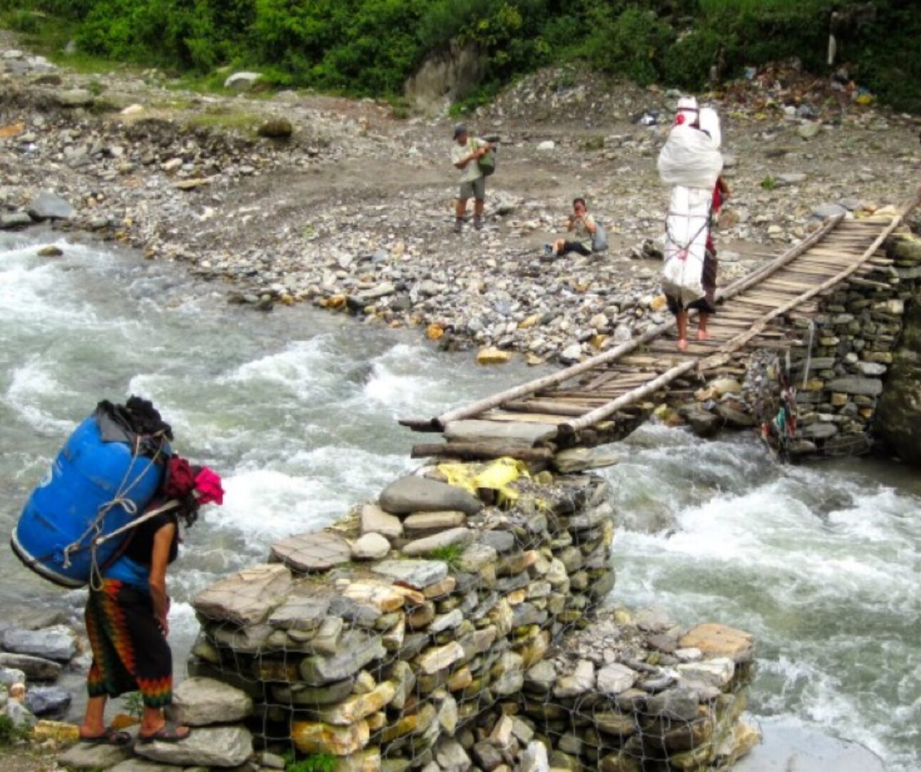 river crossing rudimental wooden bridge