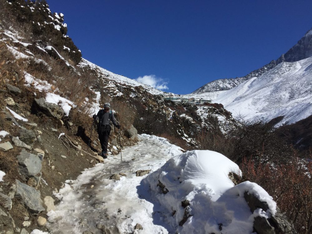 Trekker negotiating an icy trail on the trek to everest base camp