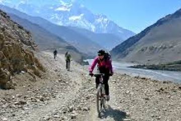 a person standing in front of a mountain